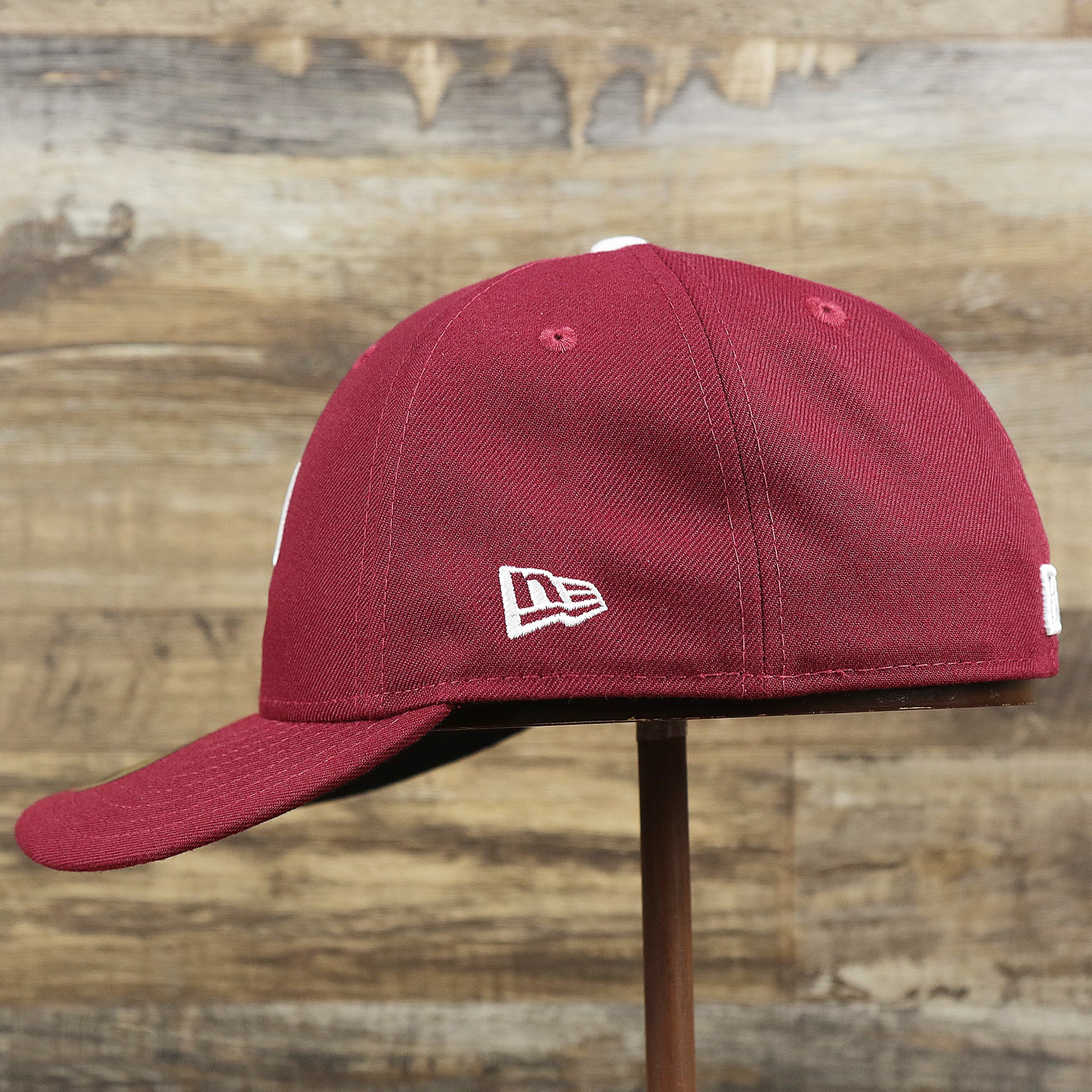 new era logo on the Philadelphia Phillies 2019 Logo Black Bottom | Maroon 59Fifty Fitted Cap
