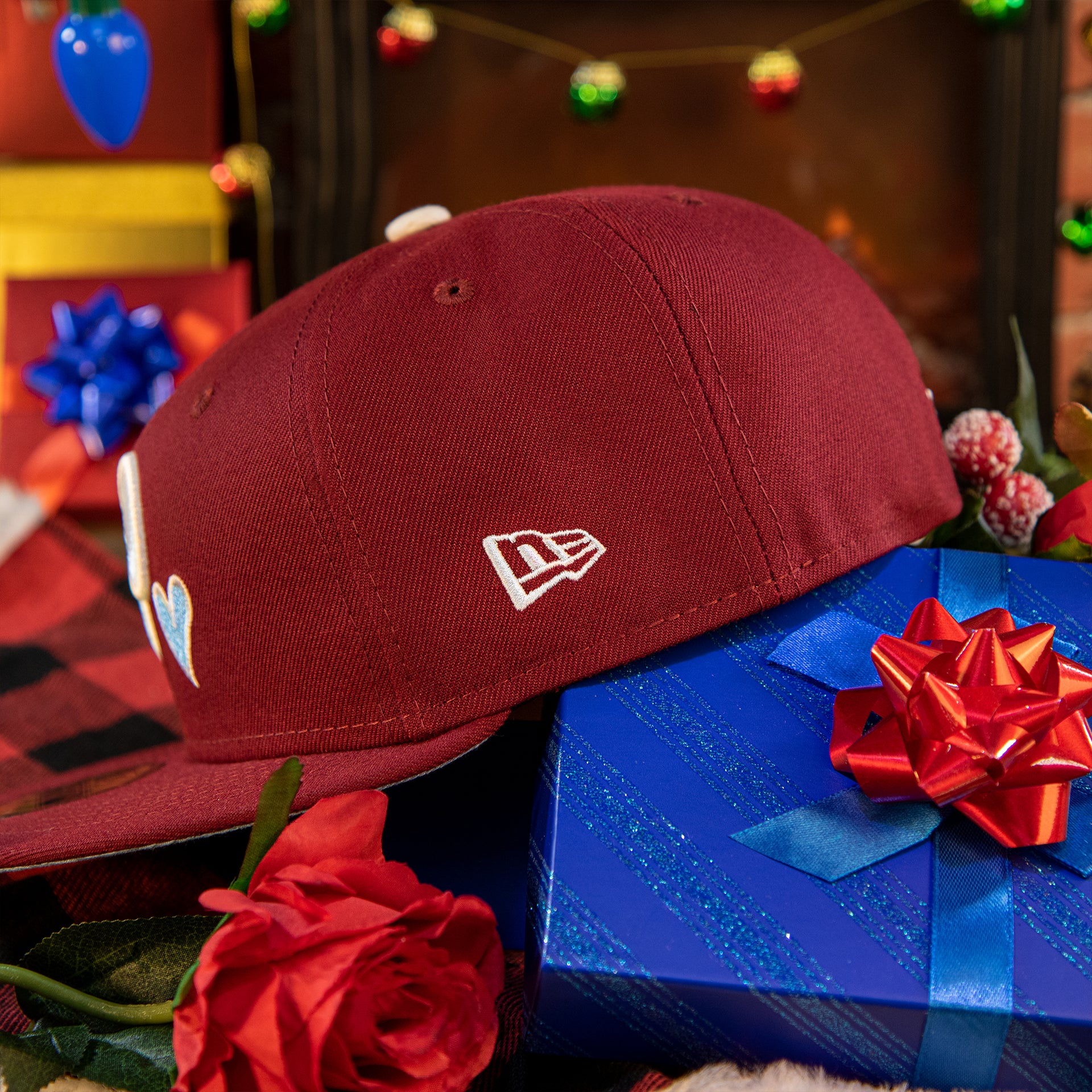 new era logo on the Philadelphia Phillies Heart Patch 1980 World Series Icy Blue Bottom Brim Fitted | Phillies Maroon Icy Blue Underbrim Side Patch 59Fifty Hat