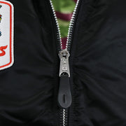 A zipper with Alpha engraved on it on the Cooperstown Philadelphia Phillies MLB Patch Alpha Industries Reversible Bomber Jacket With Camo Liner | Black Bomber Jacket