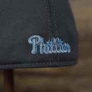 The word Phillies embroidered on the Philadelphia Phillies 2022 Father's Day On-Field 39Thirty Flexfit Cap | Gray