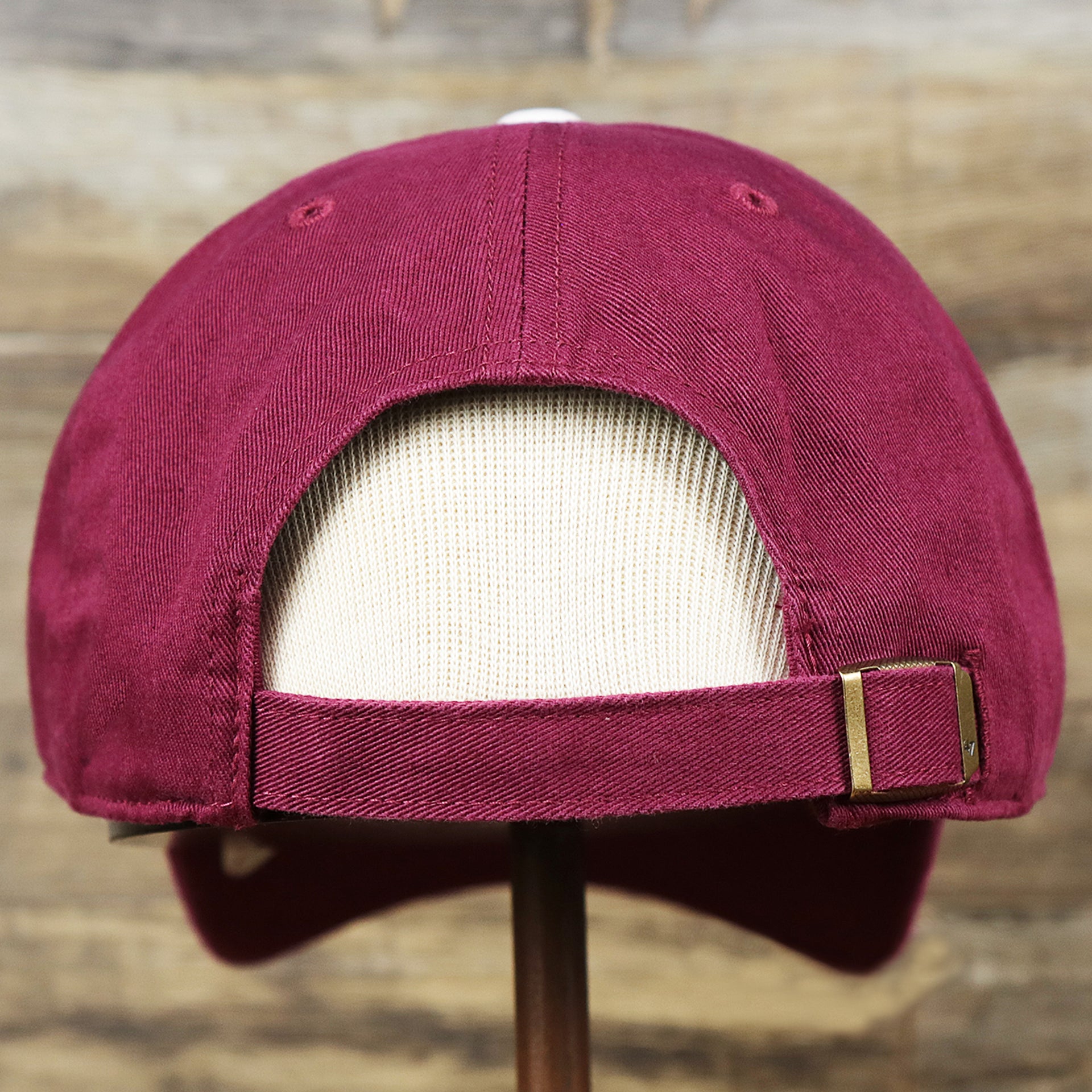 The backside of the Cooperstown Philadelphia Phillies White Cooperstown Logo Dad Hat | Cardinal Dad Hat