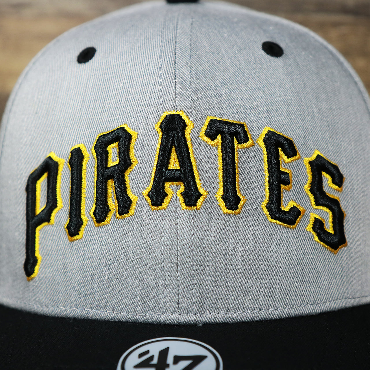 The Pirates Wordmark on the Cooperstown Pittsburgh Pirates Wordmark Green Bottom 1980s Logo Pirates Side Patch Dad Hat | Gray Dad Hat