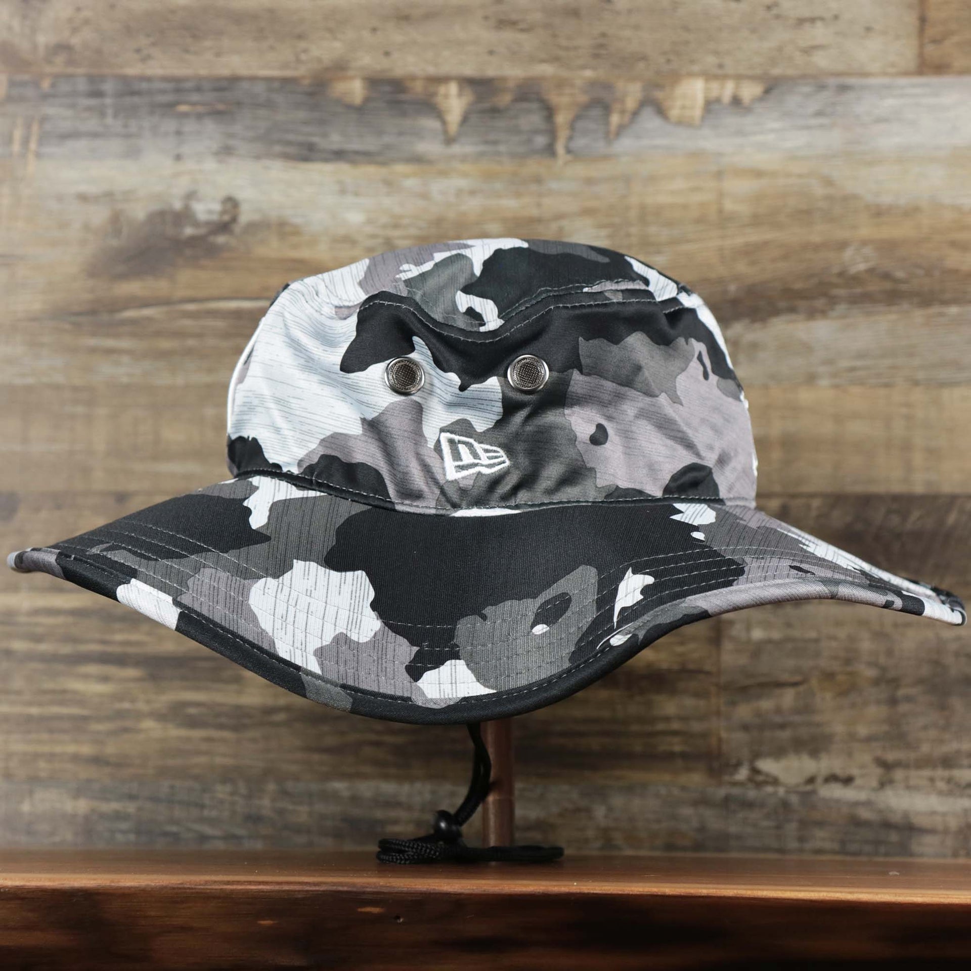 A close up of the New Era Logo embroidered on the