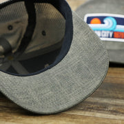 The undervisor on the OCNJ Ocean City 1879 Sunset Wave Logo Mesh Stretch FIt Hat | Dark Green And Dark Grey Stretch Fit Hat