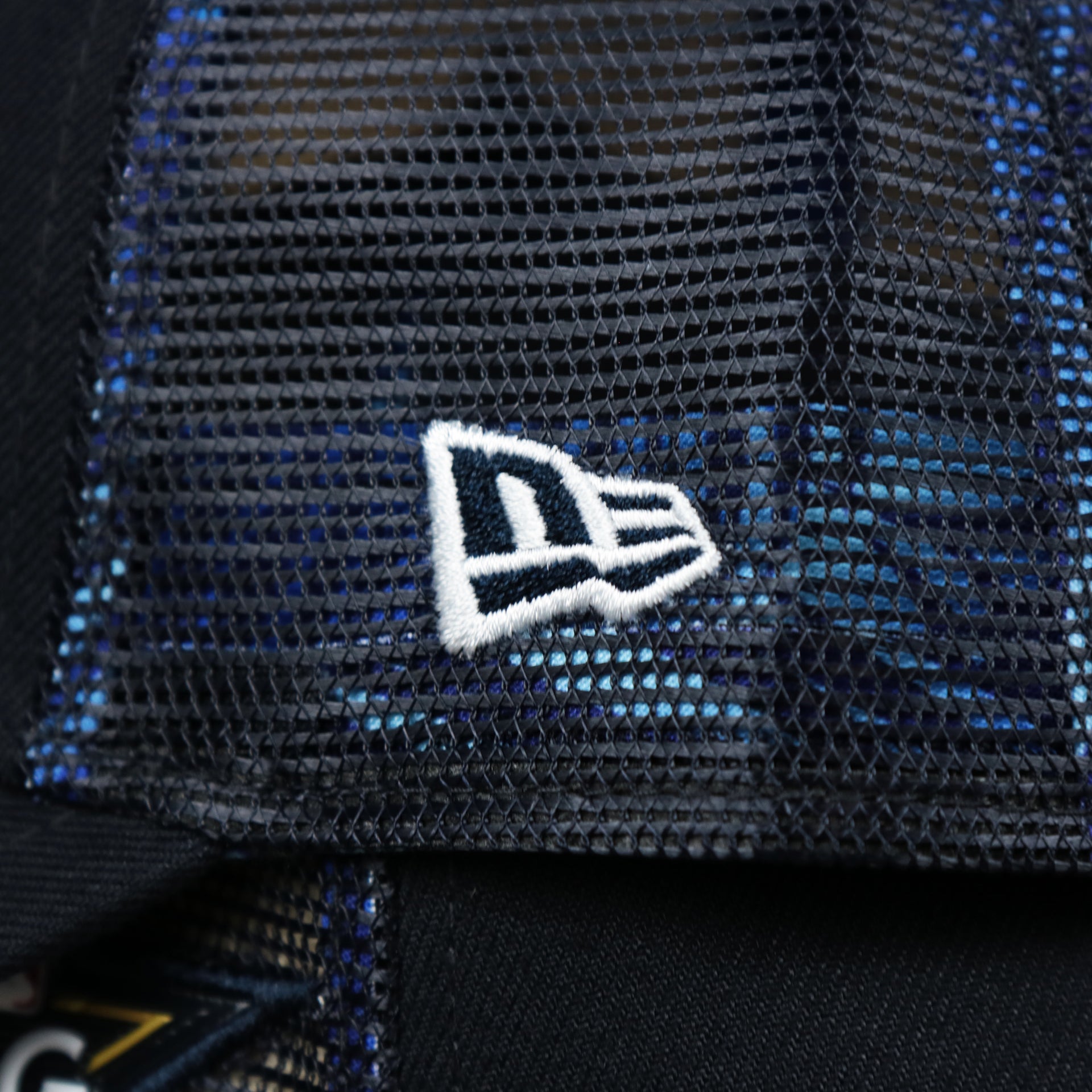 The New Era logo on the Boston Red Sox Metallic All Star Game MLB 2022 Side Patch 9Forty Mesh Trucker | ASG 2022 Navy Blue Trucker Hat