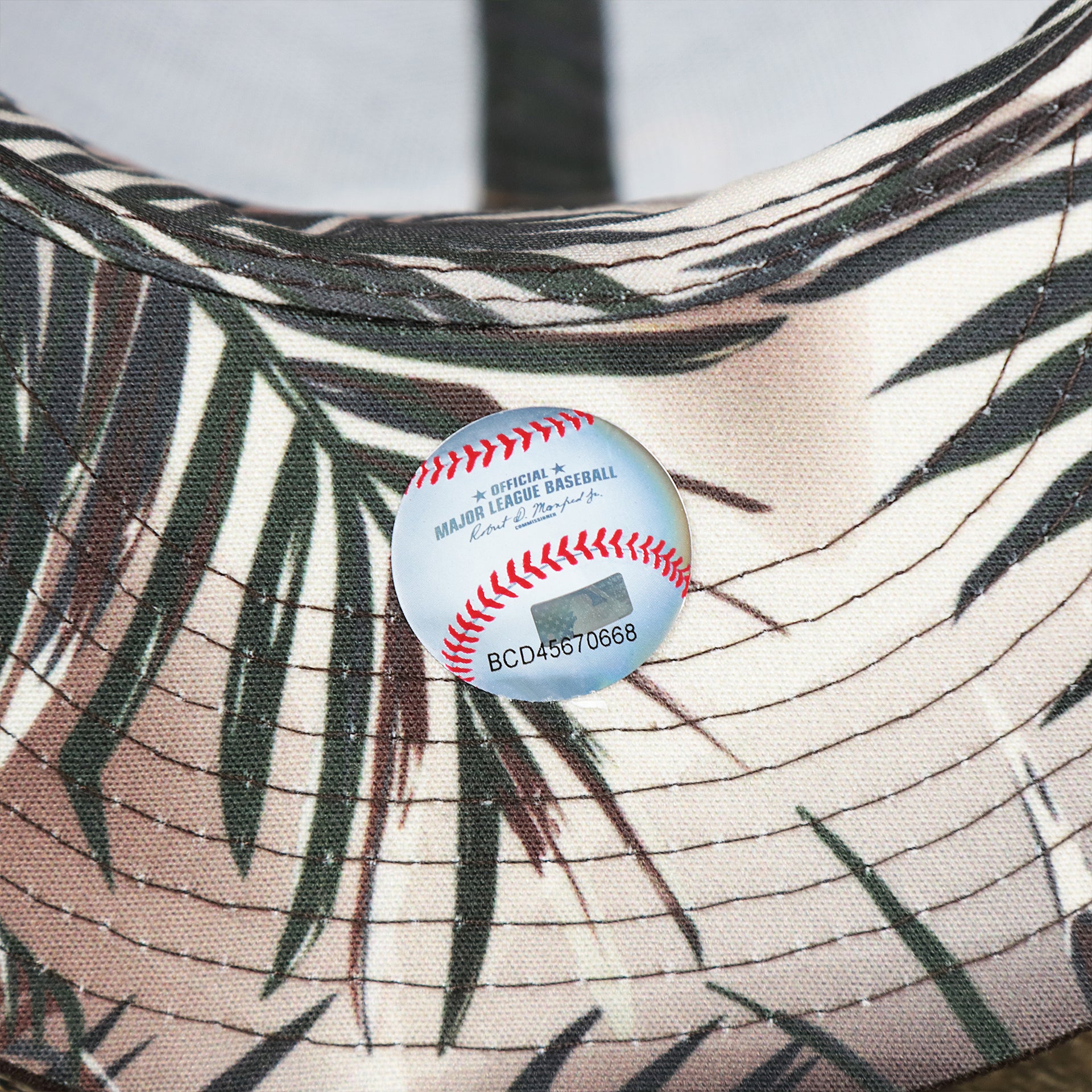 The MLB Baseball Sticker on the San Diego Padres Metallic All Star Game MLB 2022 Side Patch 9Fifty Mesh Snapback | ASG 2022 Brown Trucker Hat