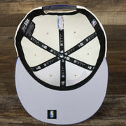 The underside of the Phoenix Suns NBA 2022 Draft Gray Bottom 9Fifty Snapback | New Era Cream/Purple