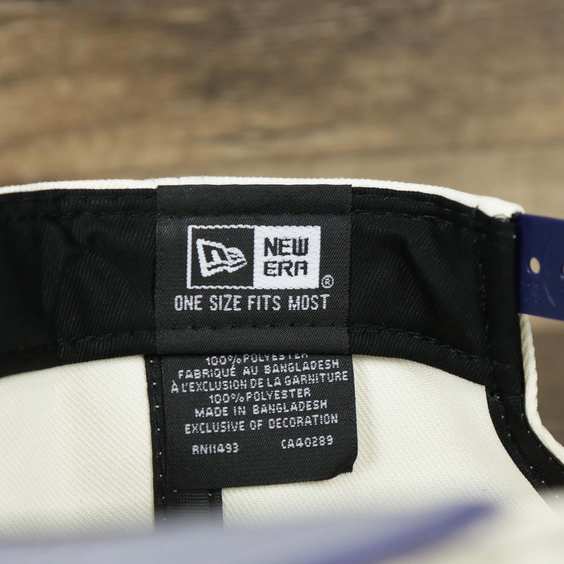 The New Era Tag on the Phoenix Suns NBA 2022 Draft Gray Bottom 9Fifty Snapback | New Era Cream/Purple