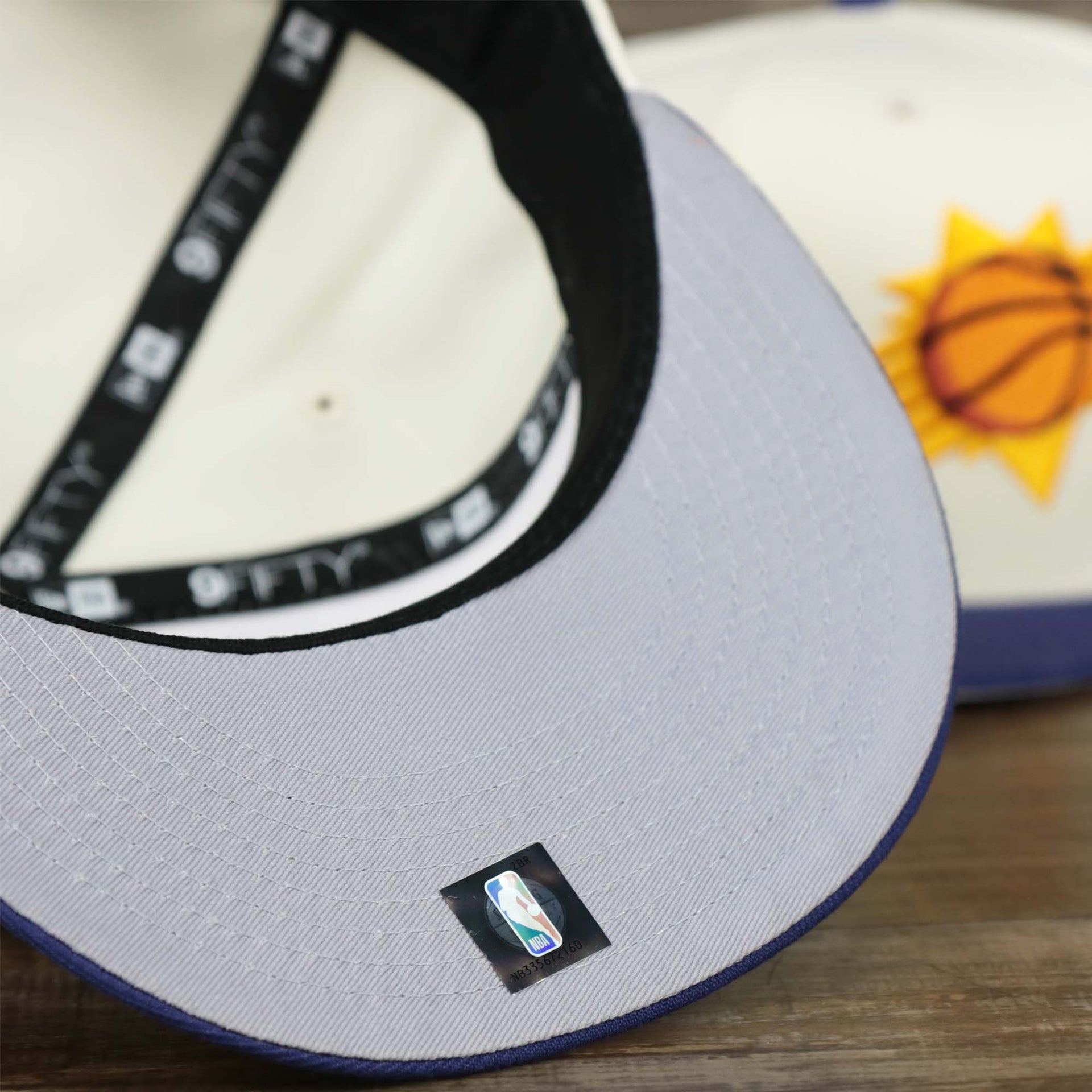 The Gray Undervisor on the Phoenix Suns NBA 2022 Draft Gray Bottom 9Fifty Snapback | New Era Cream/Purple
