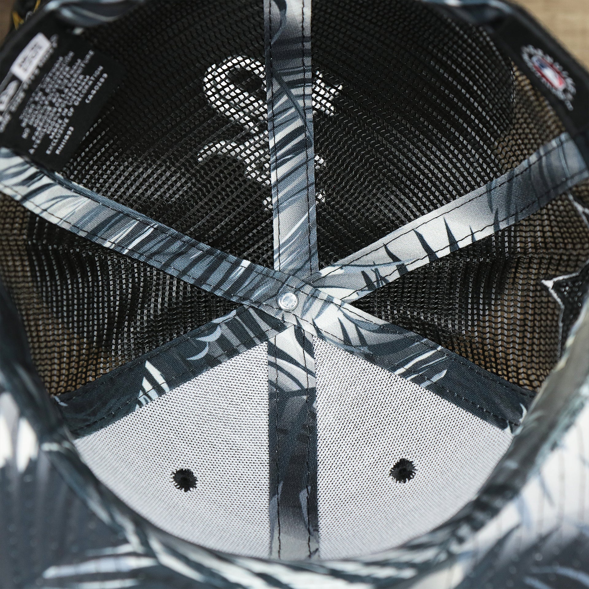 The inside of the Chicago White Sox Metallic All Star Game MLB 2022 Side Patch 9Fifty Mesh Snapback | ASG 2022 Black Trucker Hat