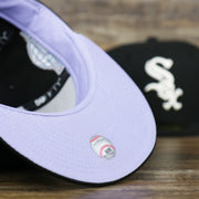 The undervisor on the Chicago White Sox Pop Sweat Pastel World Series Side Patch Fitted Cap With Purple Undervisor | Black 59Fifty Cap