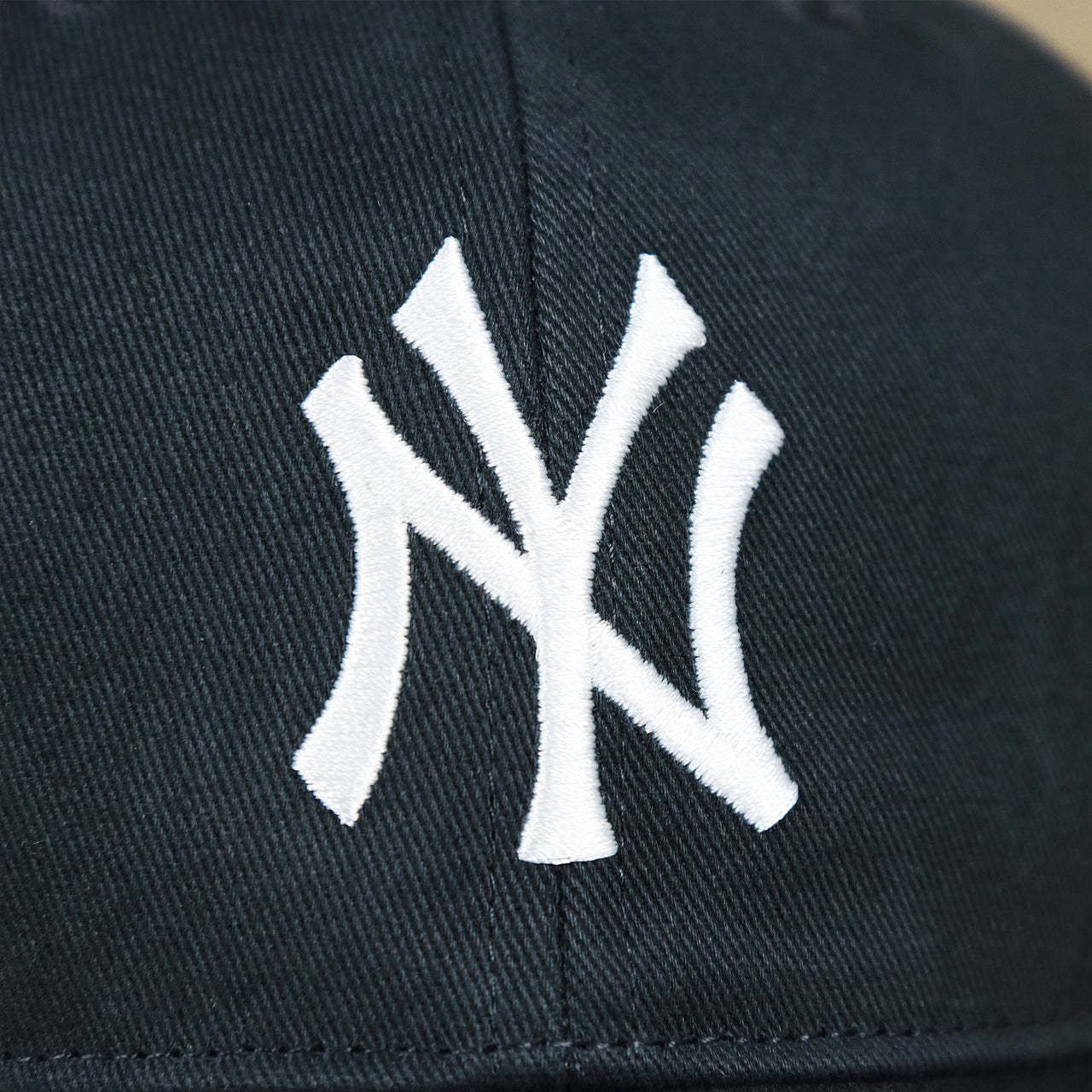 The Yankees Logo on the Kid’s New York Yankees Gray Bottom Dad Hat | Navy Kid’s Dad Hat
