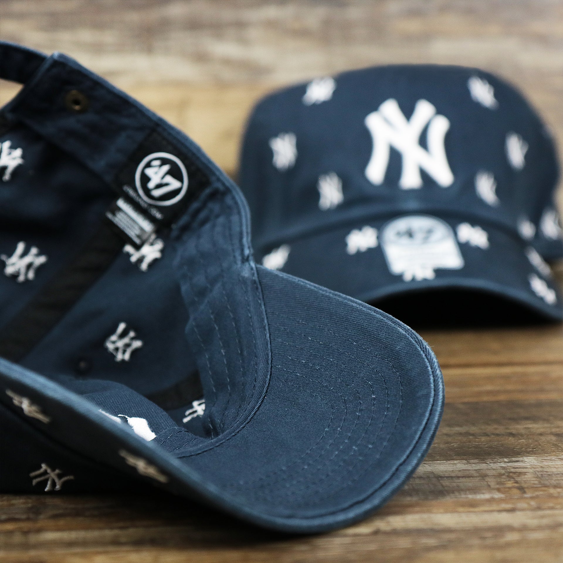 The undervisor on the Women’s New York Yankees All Over Yankees Logo Dad Hat | Navy Women’s Dad Hat