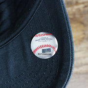 The MLB Sticker on the Women’s New York Yankees All Over Yankees Logo Dad Hat | Navy Women’s Dad Hat