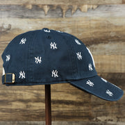 The wearer's right on the Women’s New York Yankees All Over Yankees Logo Dad Hat | Navy Women’s Dad Hat