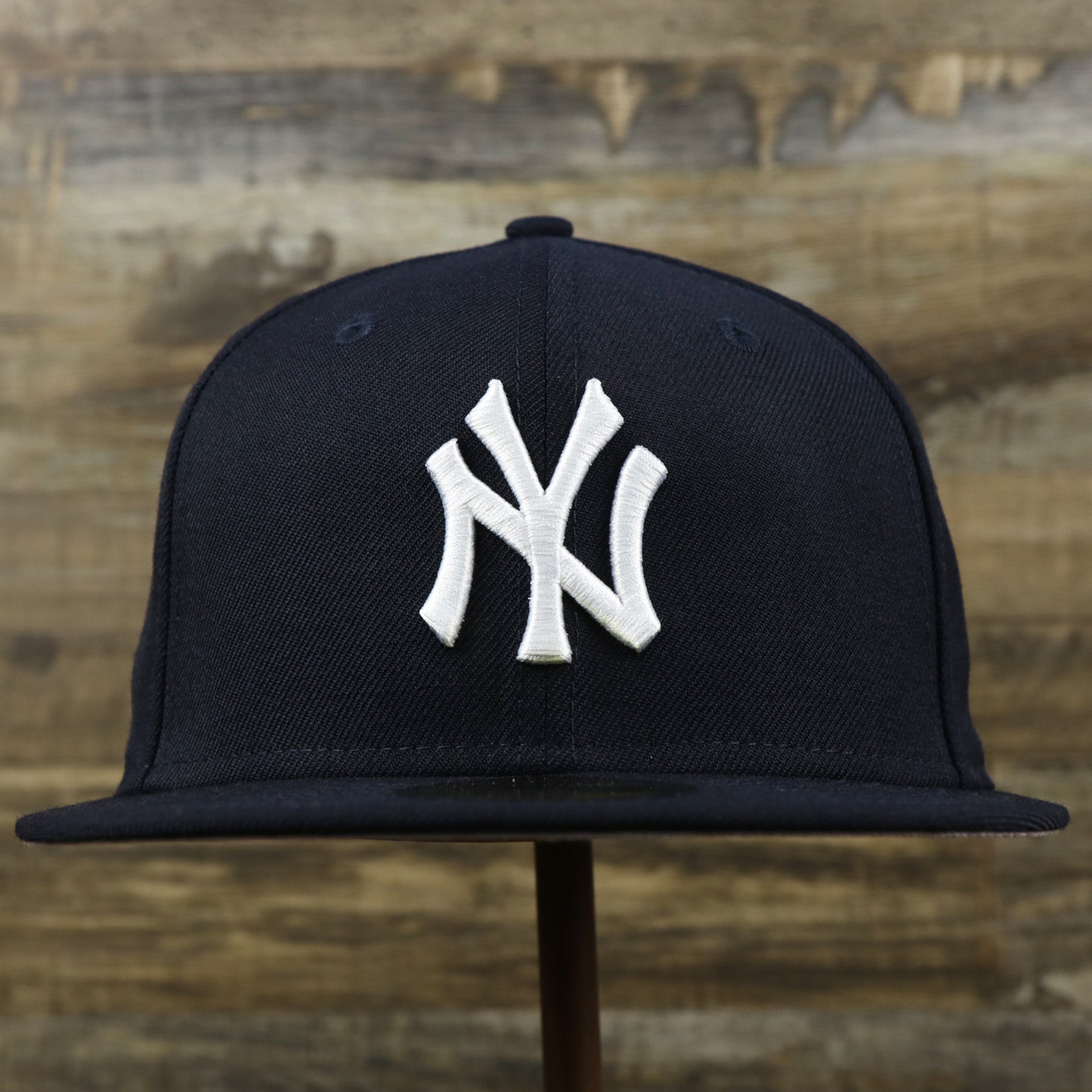 The front of the New York Yankees Gray Bottom Wool 59Fifty Fitted Cap | Navy Blue 59Fifty Cap