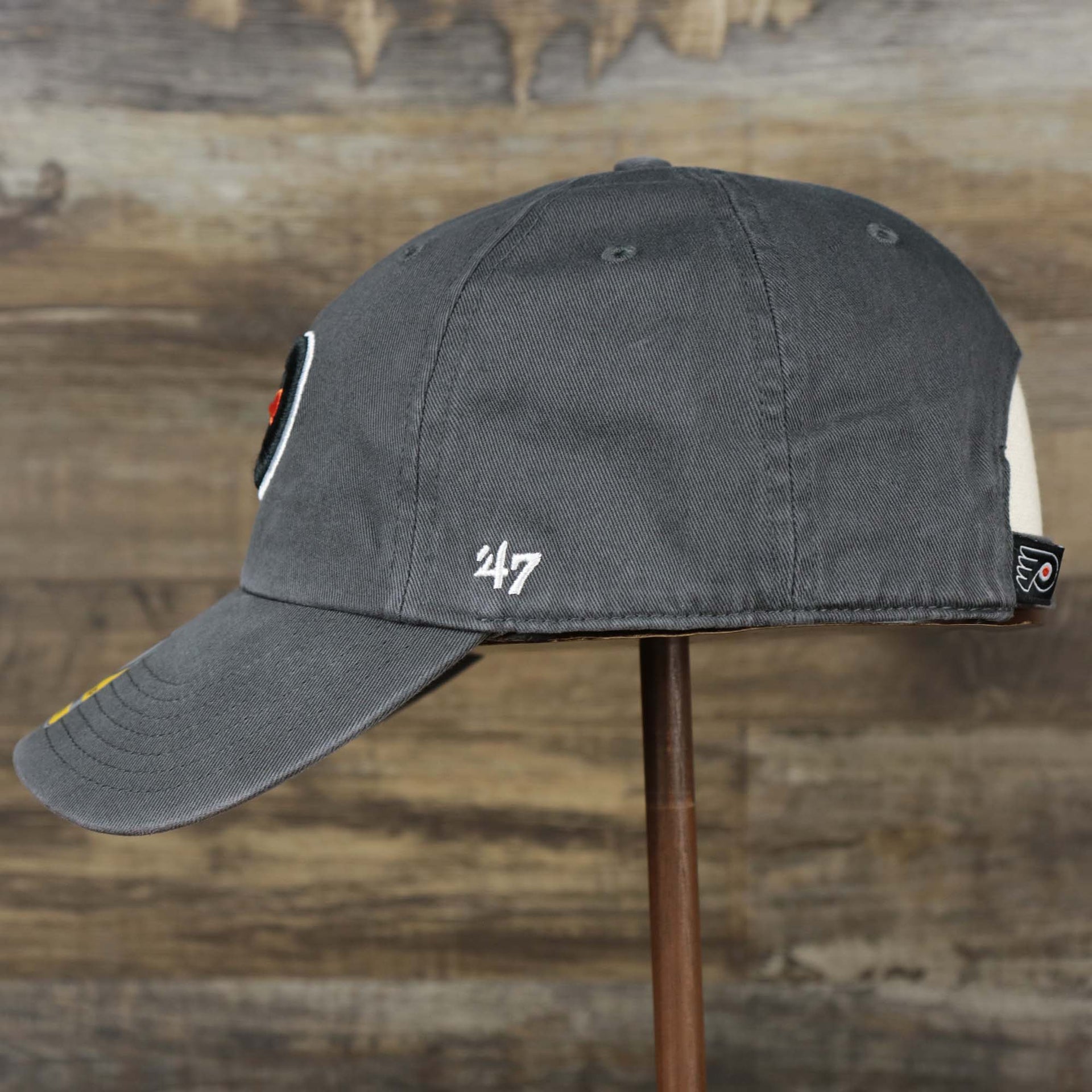 The wearer's left on the Youth Philadelphia Flyers Charcoal Dad Hat | 47 Brand OSFM