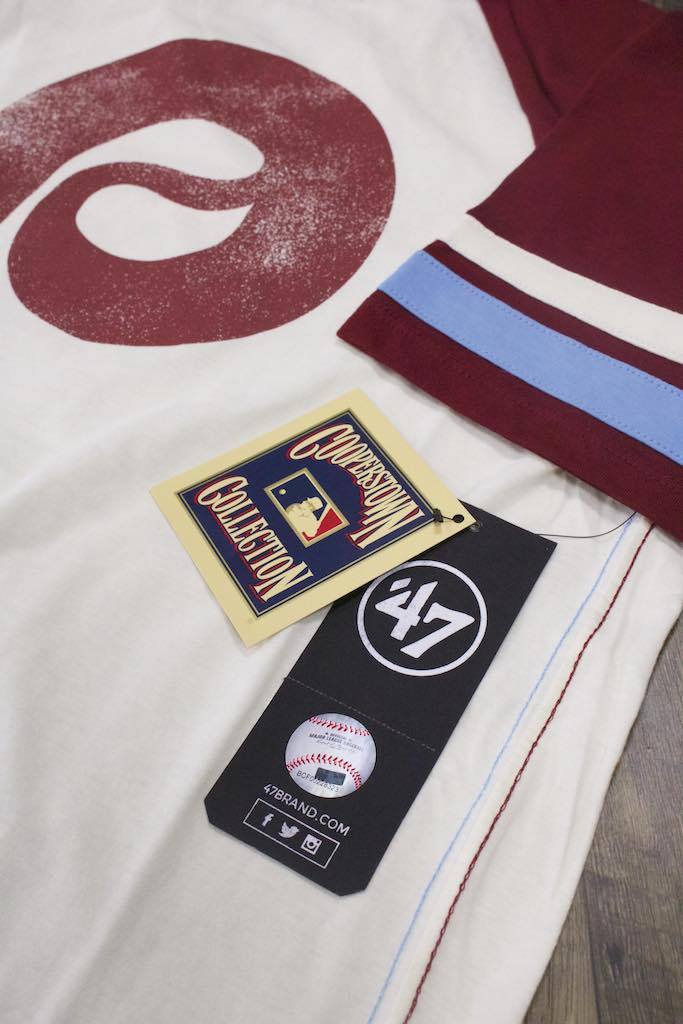 the Philadelphia Phillies Throwback Vintage 2-Tone T-Shirt | Distressed Phils Logo Cooperstown Collection Heritage Opener Tee has several authentic vintage details and a cooperstown collection tag