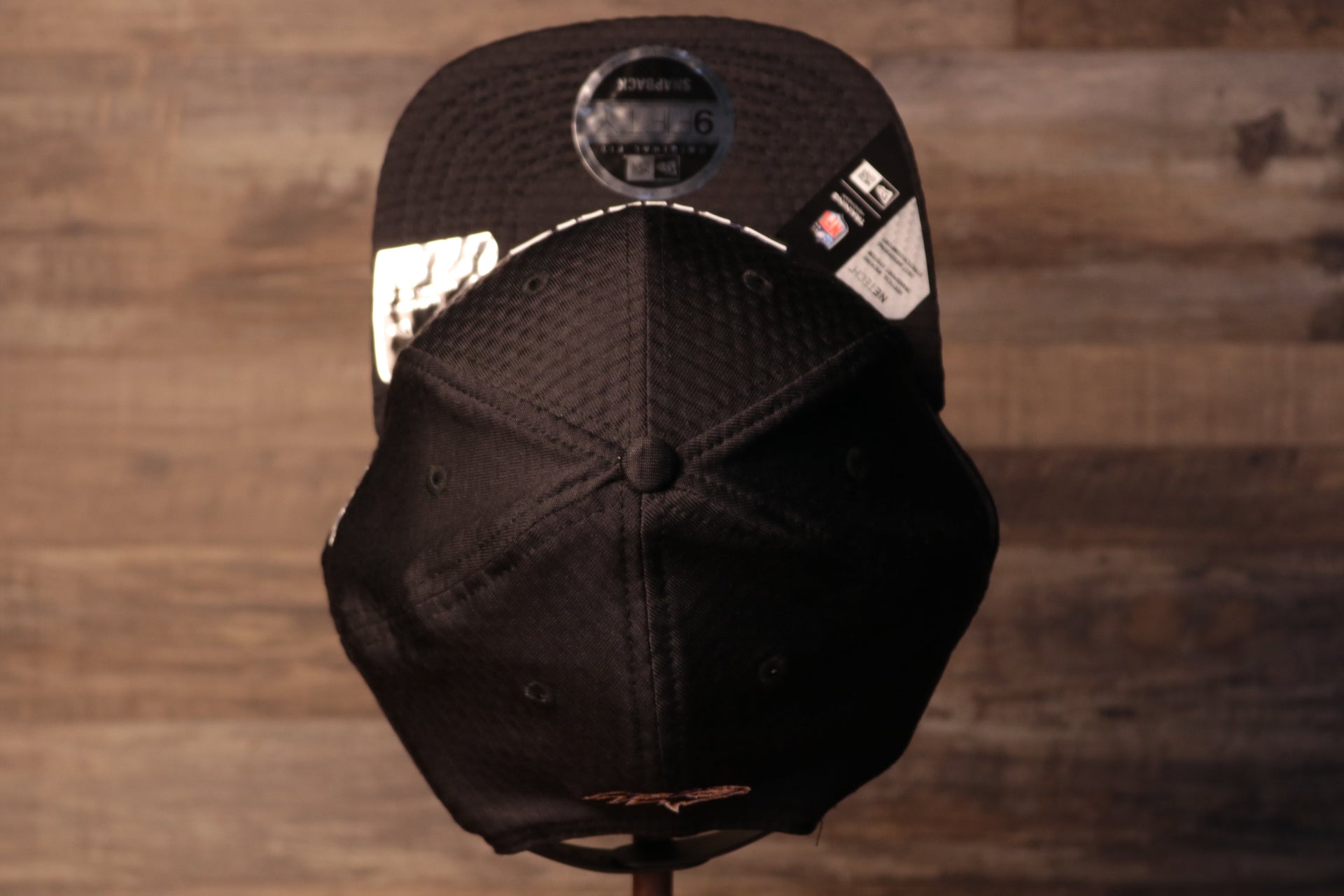 The top of this hat is a very breathable material and is very stretch Ravens 2020 Training Camp Snapback Hat | Baltimore 2020 On-Field Black Training Camp Snap Cap
