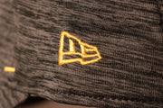 The new era logo is yellow Packers 2020 Training Camp Flexfit | Green Bay Packers 2020 On-Field Grey Training Camp Stretch Fit