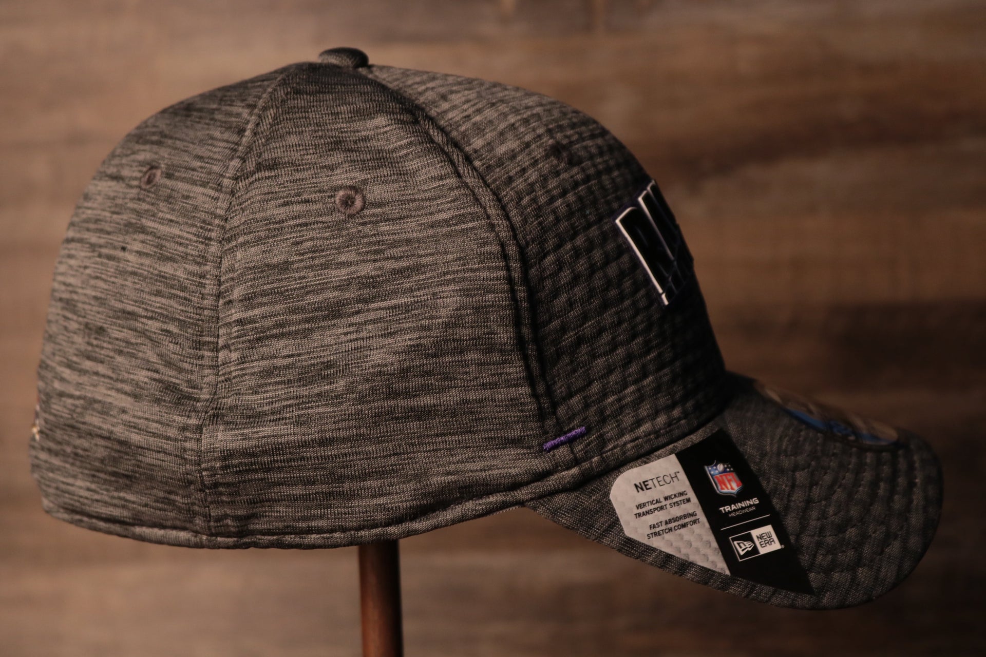 The wearers right side is blank Ravens 2020 Training Camp Flexfit | Baltimore Ravens 2020 On-Field Grey Training Camp Stretch Fit