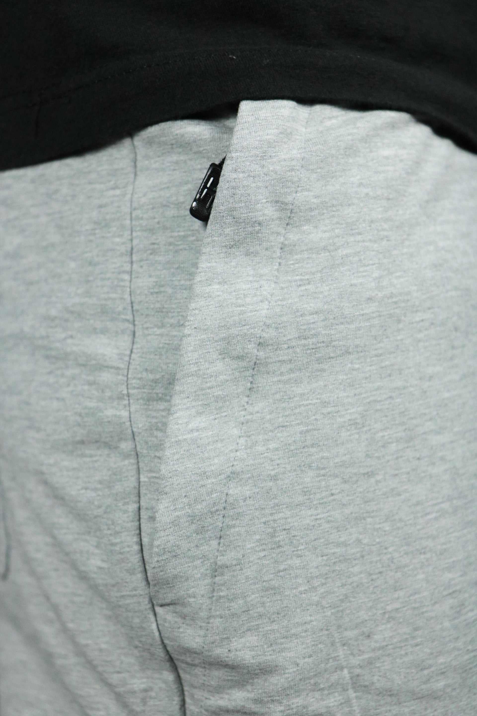 One of the two zipped pockets of the Jordan Craig french terry shorts.