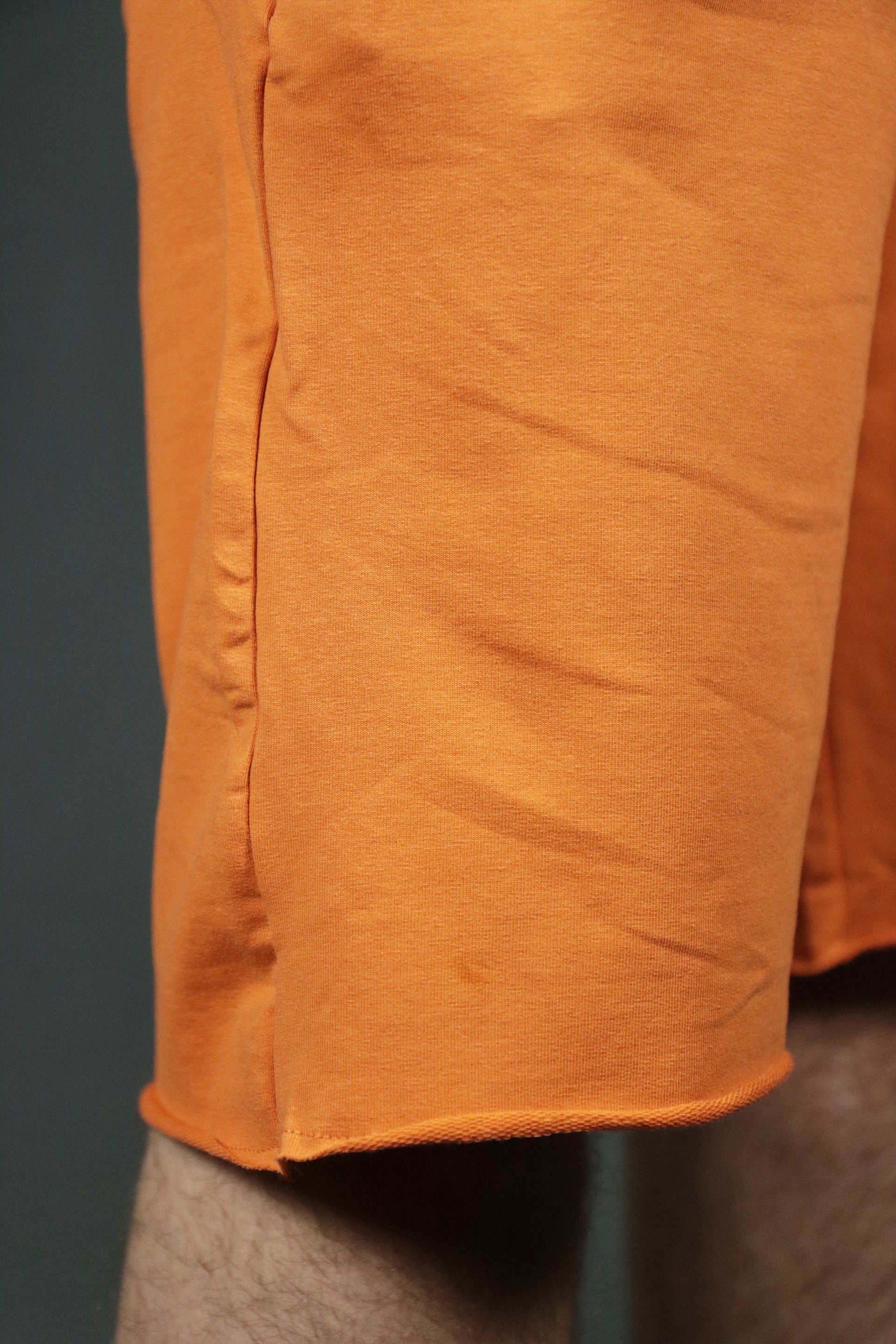 The orange terry towel shorts by Jordan Craig. 