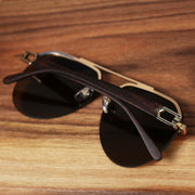 The Round Aviator Frames Brown Lens Sunglasses with Gold Frame folded up