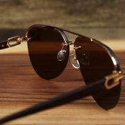 The inside of the Round Aviator Frames Brown Lens Sunglasses with Gold Frame