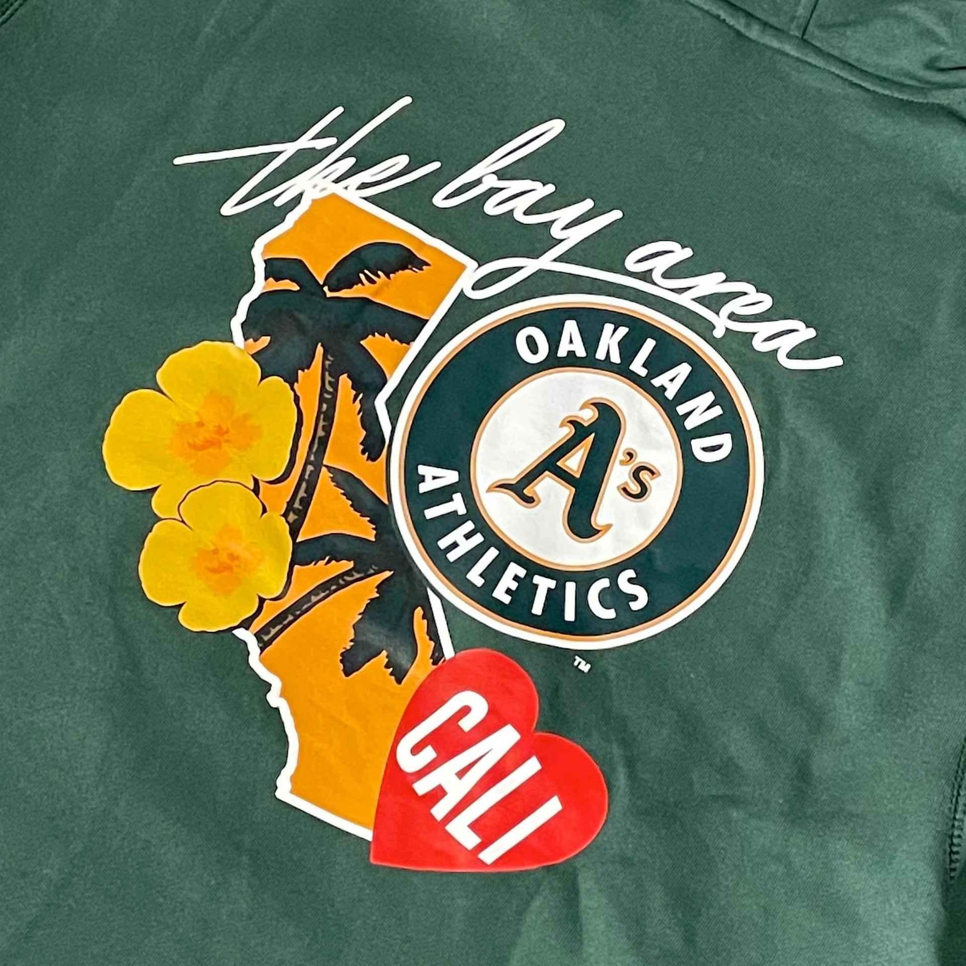 Close up of cluster logo on the back of the Oakland Athletics "City Cluster" 59Fifty Fitted Matching Green Pullover Hoodie