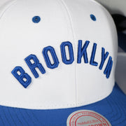 brooklyn wordmark on the Brooklyn Dodgers Cooperstown "Brooklyn" Jersey Script 1932 Dodgers logo side patch Evergreen Pro | White/Royal Snapback Hat