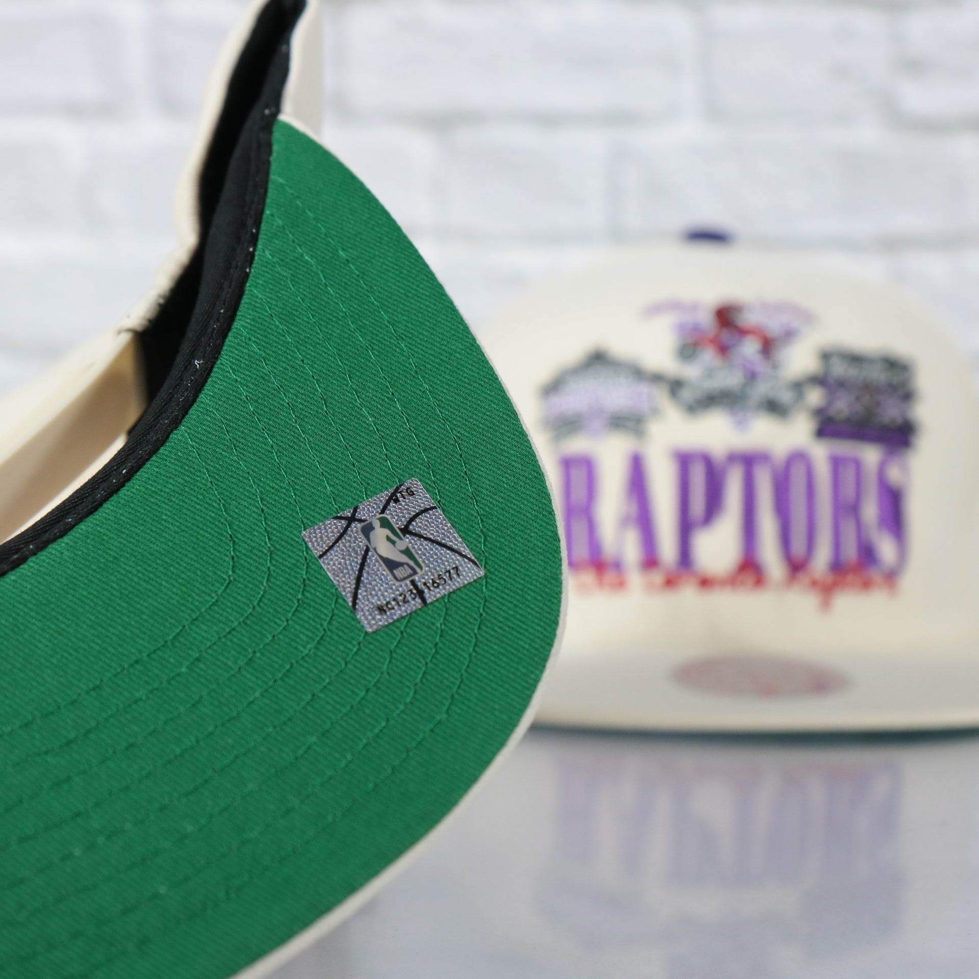 green under visor on the Toronto Raptors Hardwood Classics Reframe Retro Green bottom | Off-White Snapback Hat