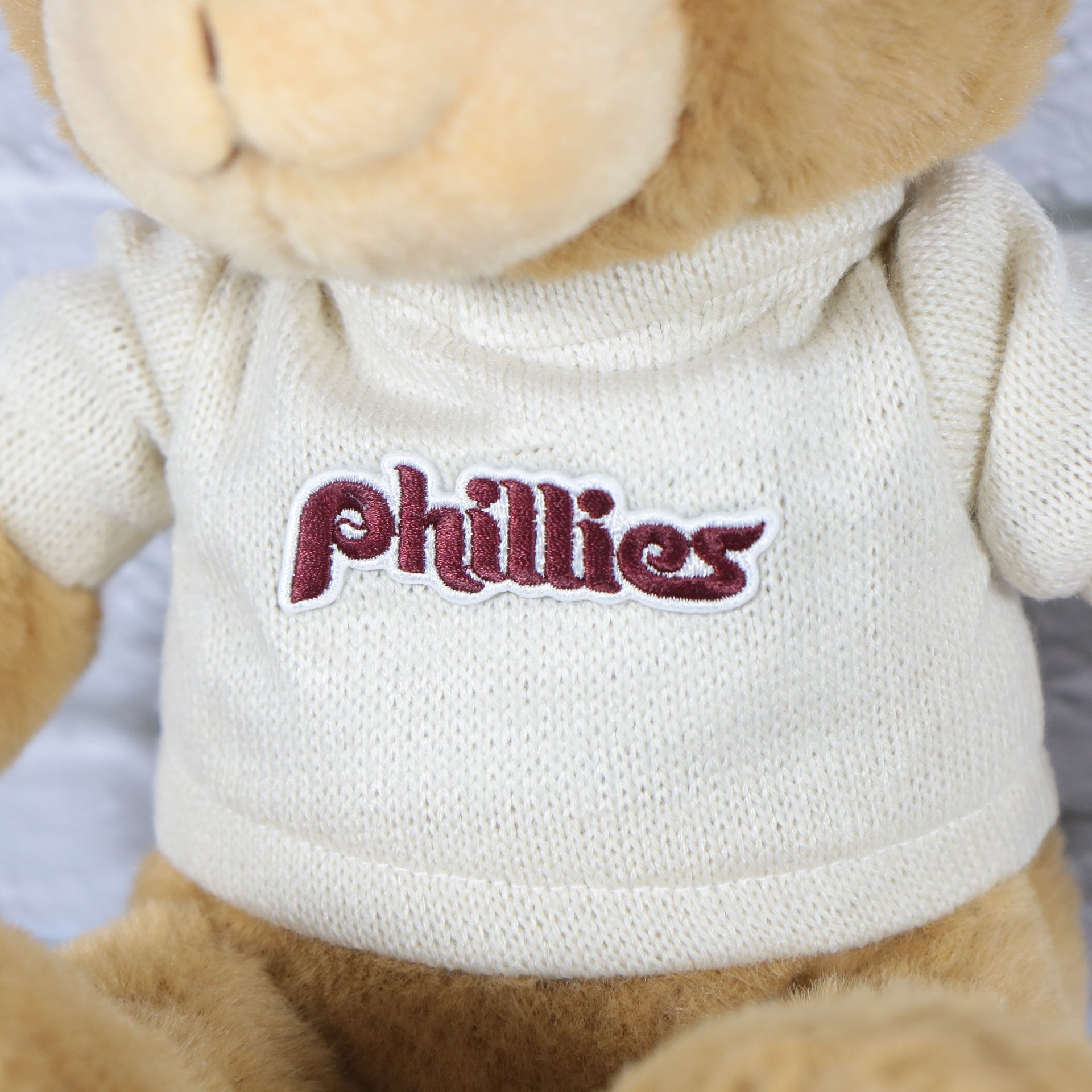 phillies wordmark  on the Philadelphia Phillies Fuzzy Wuzzy "Phillies" Cooperstown wordmark Cream Sweater | Light Brown Teddy Bear