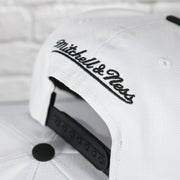 mitchell and ness logo on the Philadelphia 76ers Cement Top Black Bottom 2-Tone | White/Silver Snapback Hat