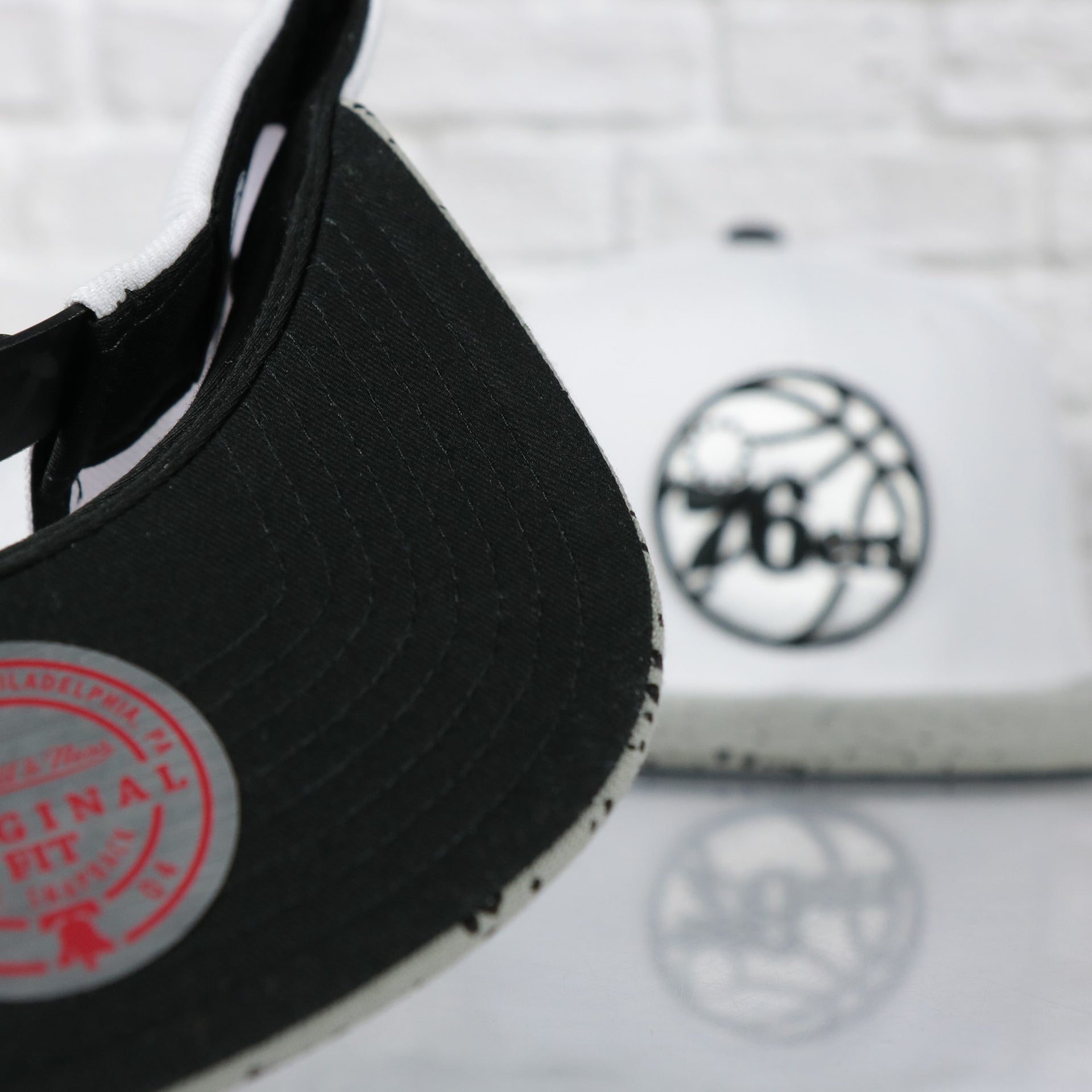 black under visor on the Philadelphia 76ers Cement Top Black Bottom 2-Tone | White/Silver Snapback Hat