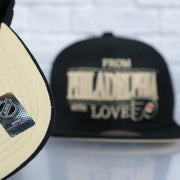 cream under visor on the Philadelphia Flyers With Love 25th Anniversary Side Patch Cream Bottom | Black Snapback Hat