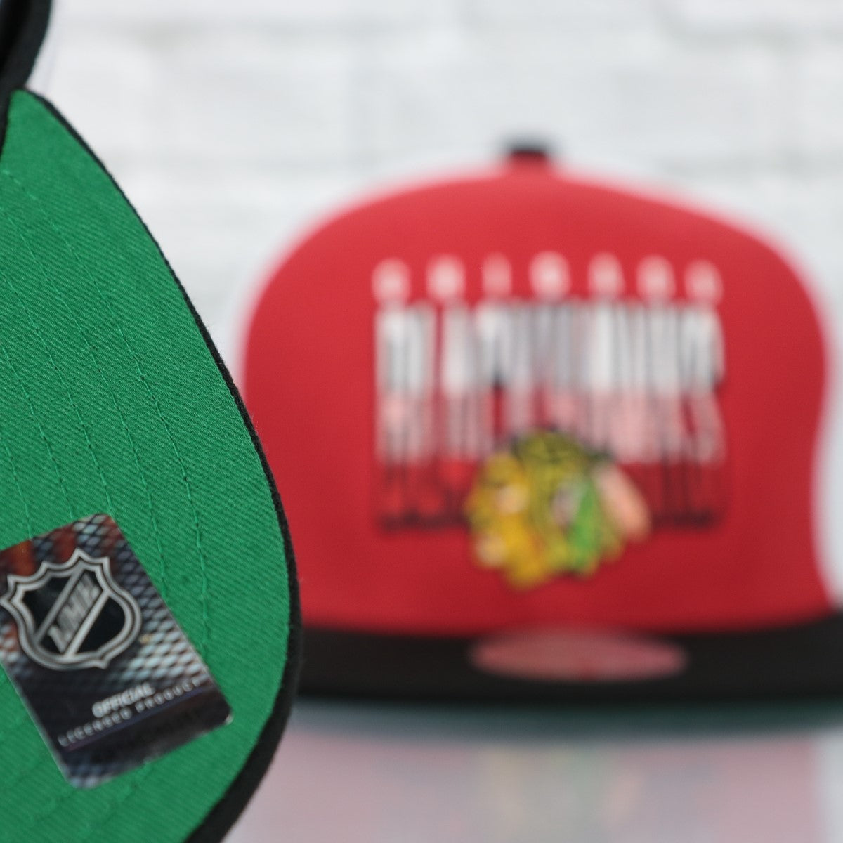 green bottom on the Chicago Blackhawks NHL Billboard 2 Green bottom Tri-Tone | Red/White/Black Snapback Hat