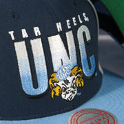tar heels logo on the North Carolina Tar Heels NCAA Billboard 2 Green bottom Tri-Tone | Blue/White/Light Blue Snapback Hat
