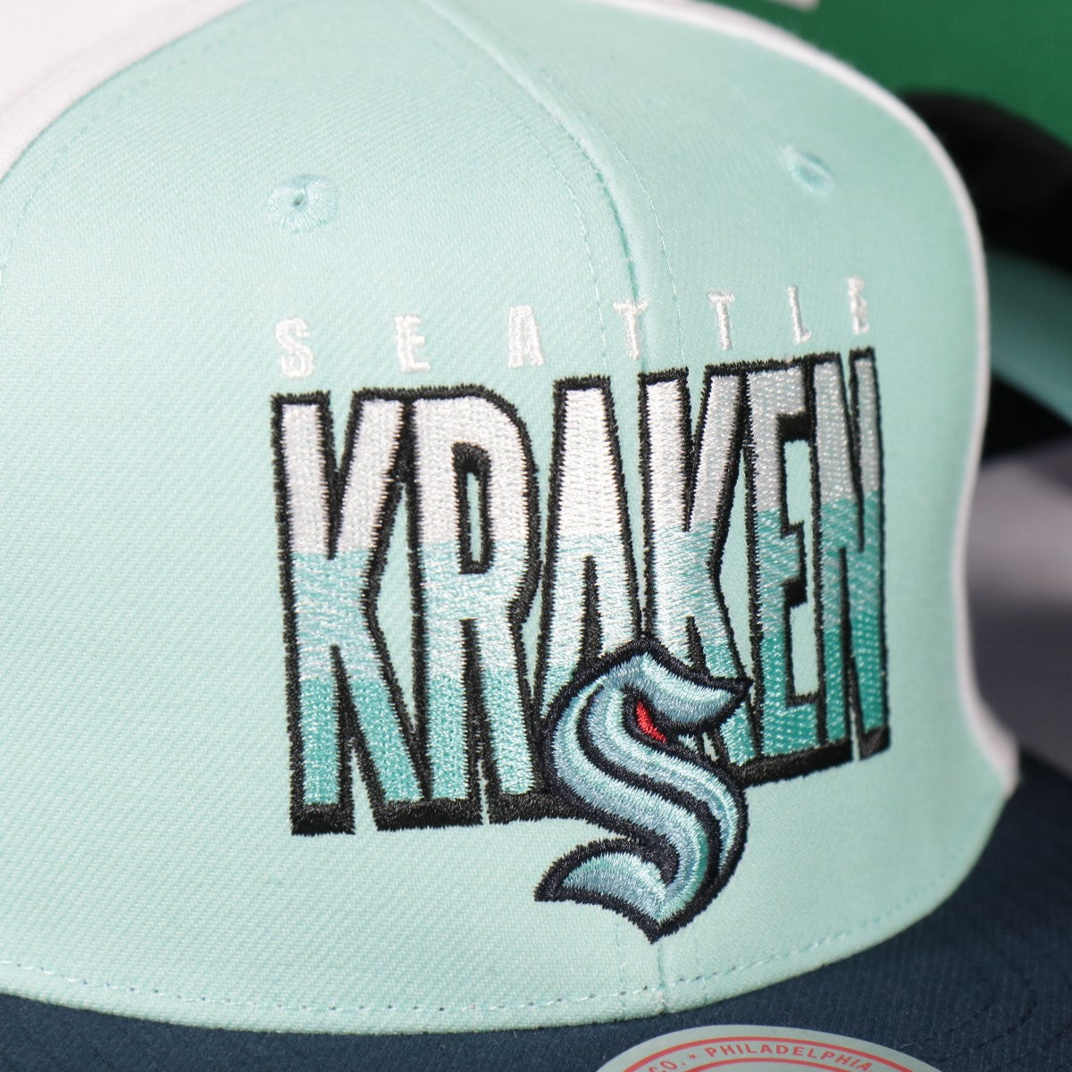 kraken logo on the Seattle Kraken  NHL Billboard 2 Green bottom Tri-Tone | Teal/Blue/Black Snapback Hat