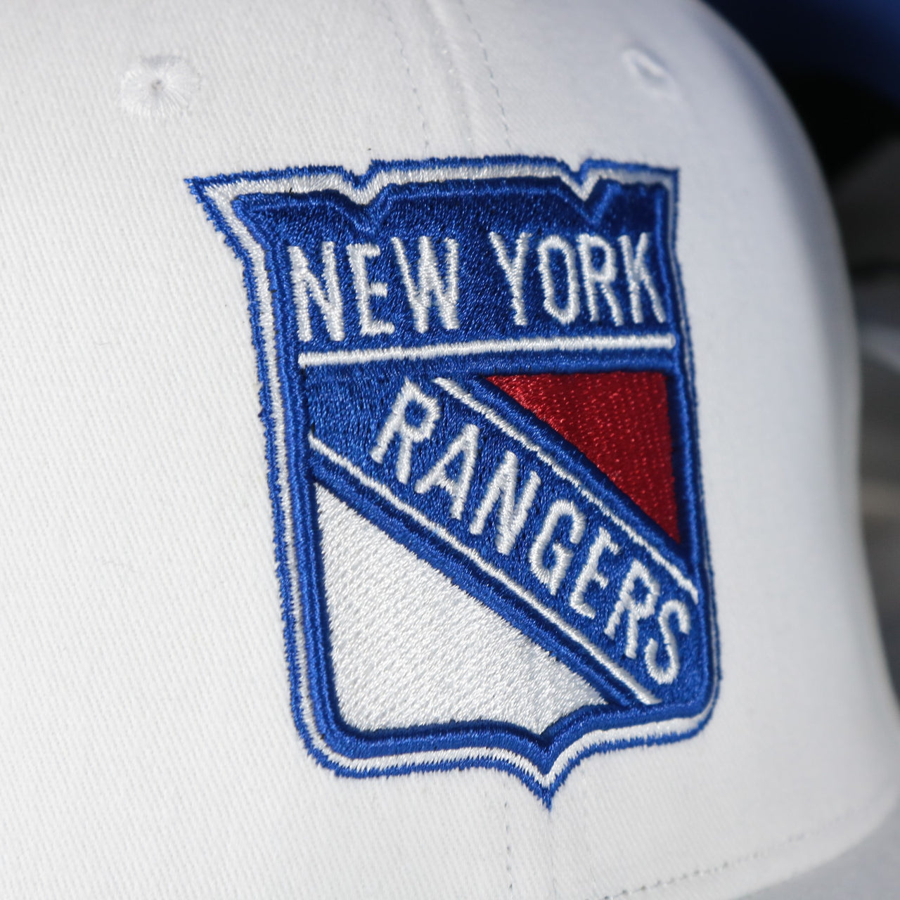 rangers logo on the New York Rangers NHL All in Pro Blue Bottom | White Snapback Hat
