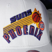 suns logo on the Phoenix Suns NBA Hardwood Classics All in Pro Purple Bottom | White Snapback Hat