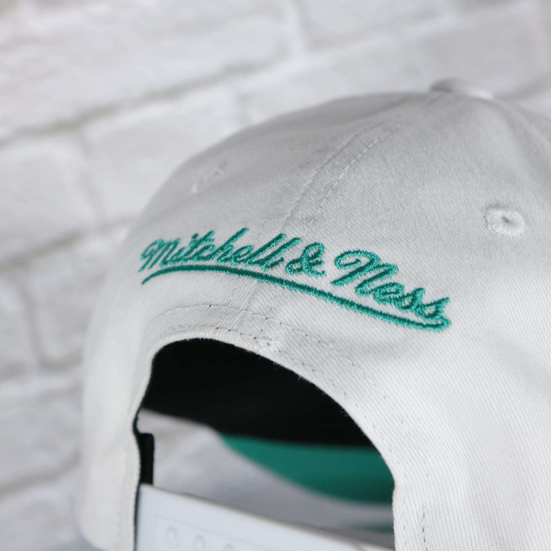 mitchell and ness logo on the San Antonio Spurs NBA Hardwood Classics All in Pro Teal Bottom | White Snapback Hat