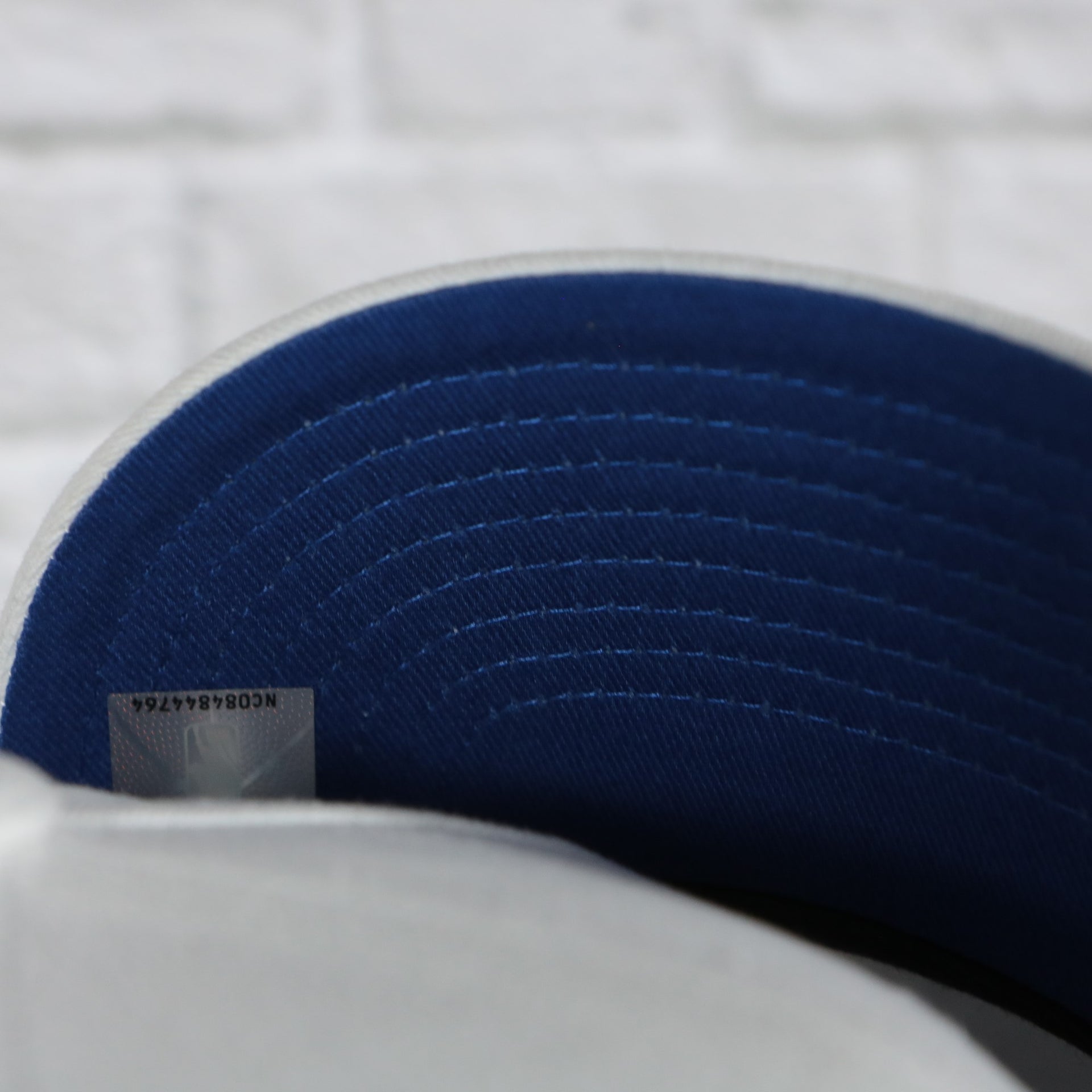 blue under visor on the New York Knicks NBA Hardwood Classics All in Pro Navy Blue Bottom | White Snapback Hat