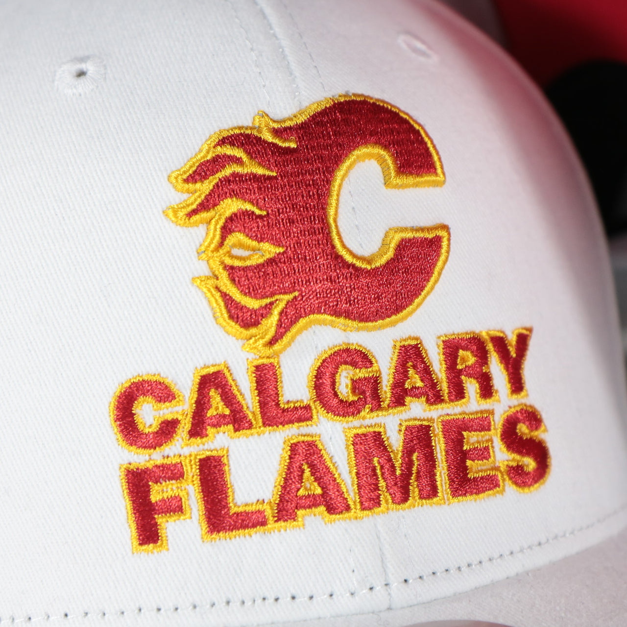 flames logo on the Calgary Flames NHL All in Pro Red Bottom | White Snapback Hat