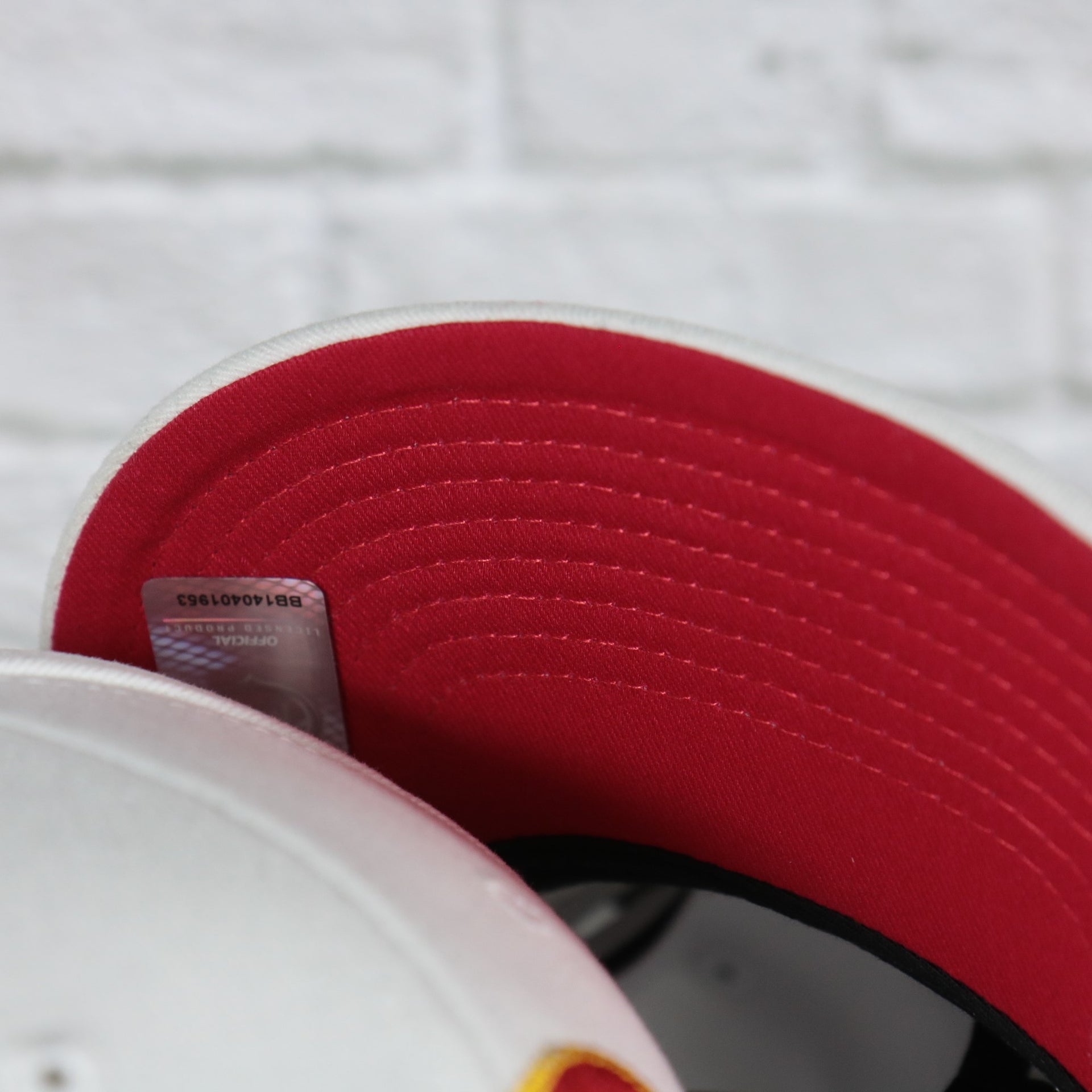 red under visor on the Calgary Flames NHL All in Pro Red Bottom | White Snapback Hat