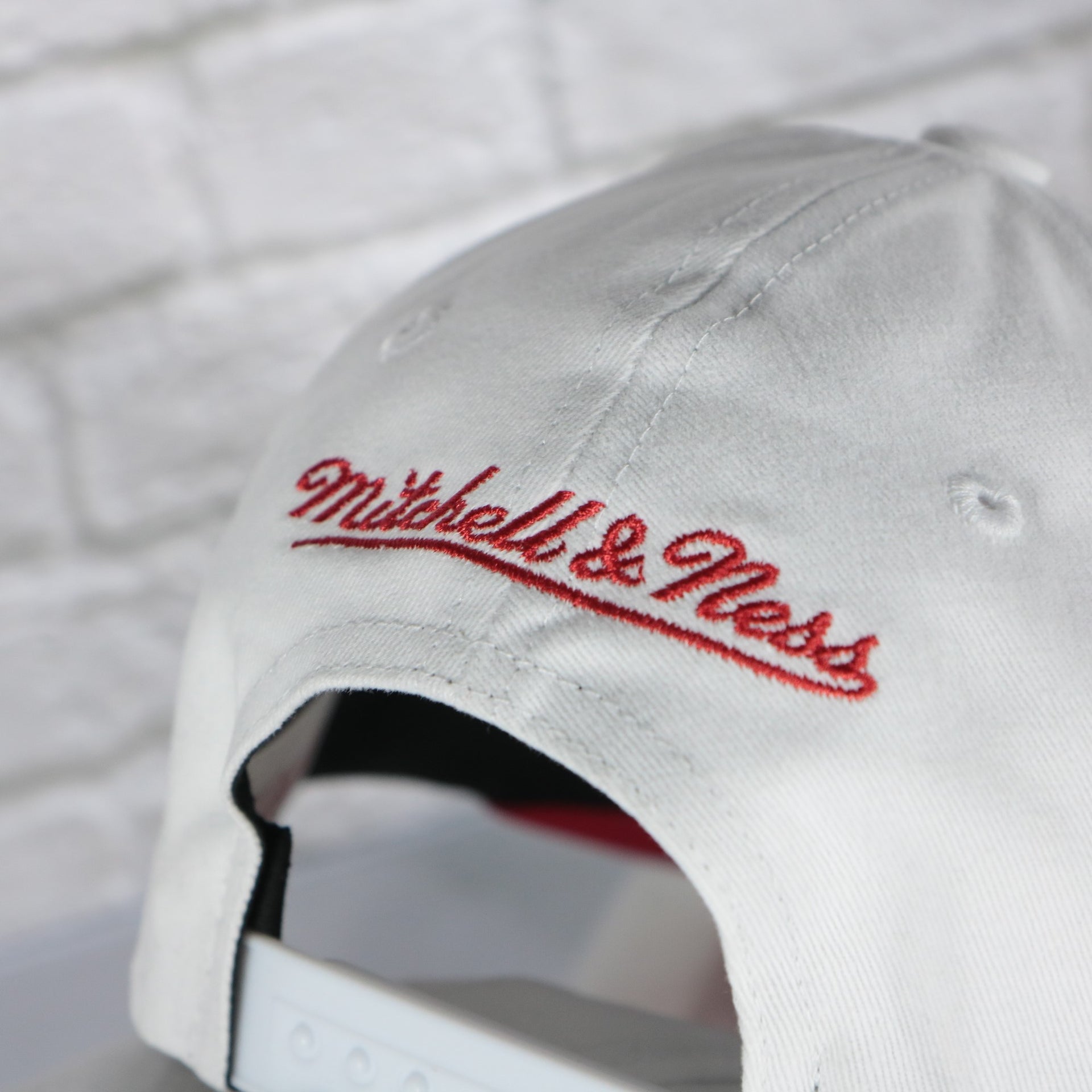 mitchell and ness logo on the Calgary Flames NHL All in Pro Red Bottom | White Snapback Hat