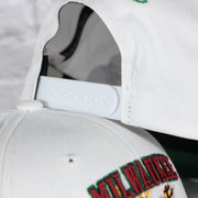 white adjustable snap on the Milwaukee Bucks NBA Hardwood Classics All in Pro Green Bottom | White Snapback Hat