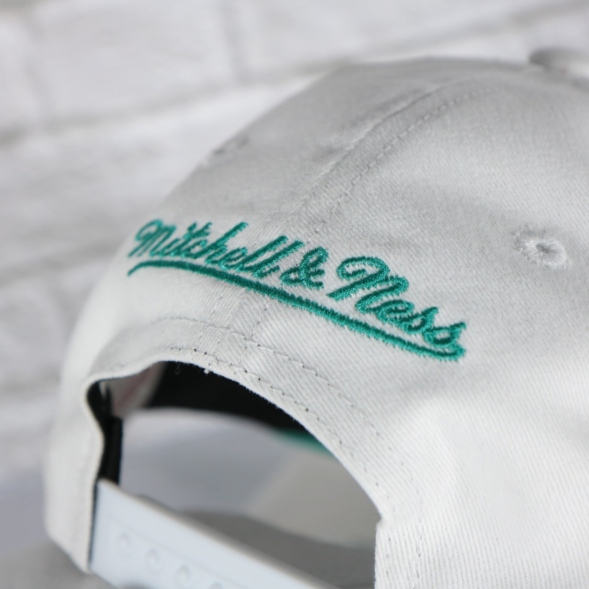 mitchell and ness logo on the Memphis Grizzlies NBA Hardwood Classics All in Pro Teal Bottom | White Snapback Hat