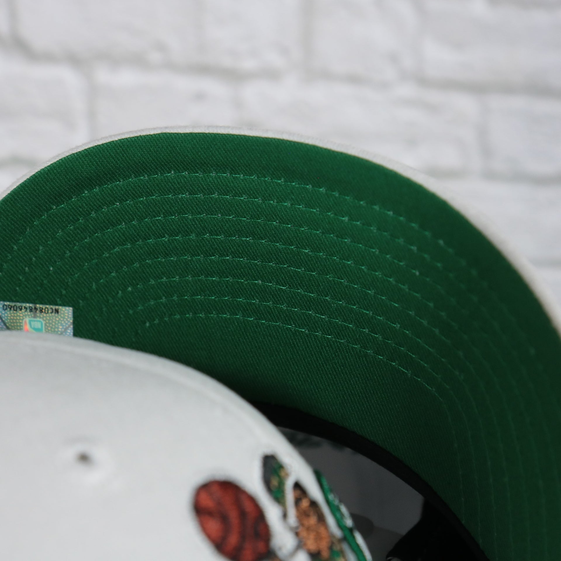 green under visor on the Boston Celtics NBA Hardwood Classics All in Pro Green Bottom | White Snapback Hat