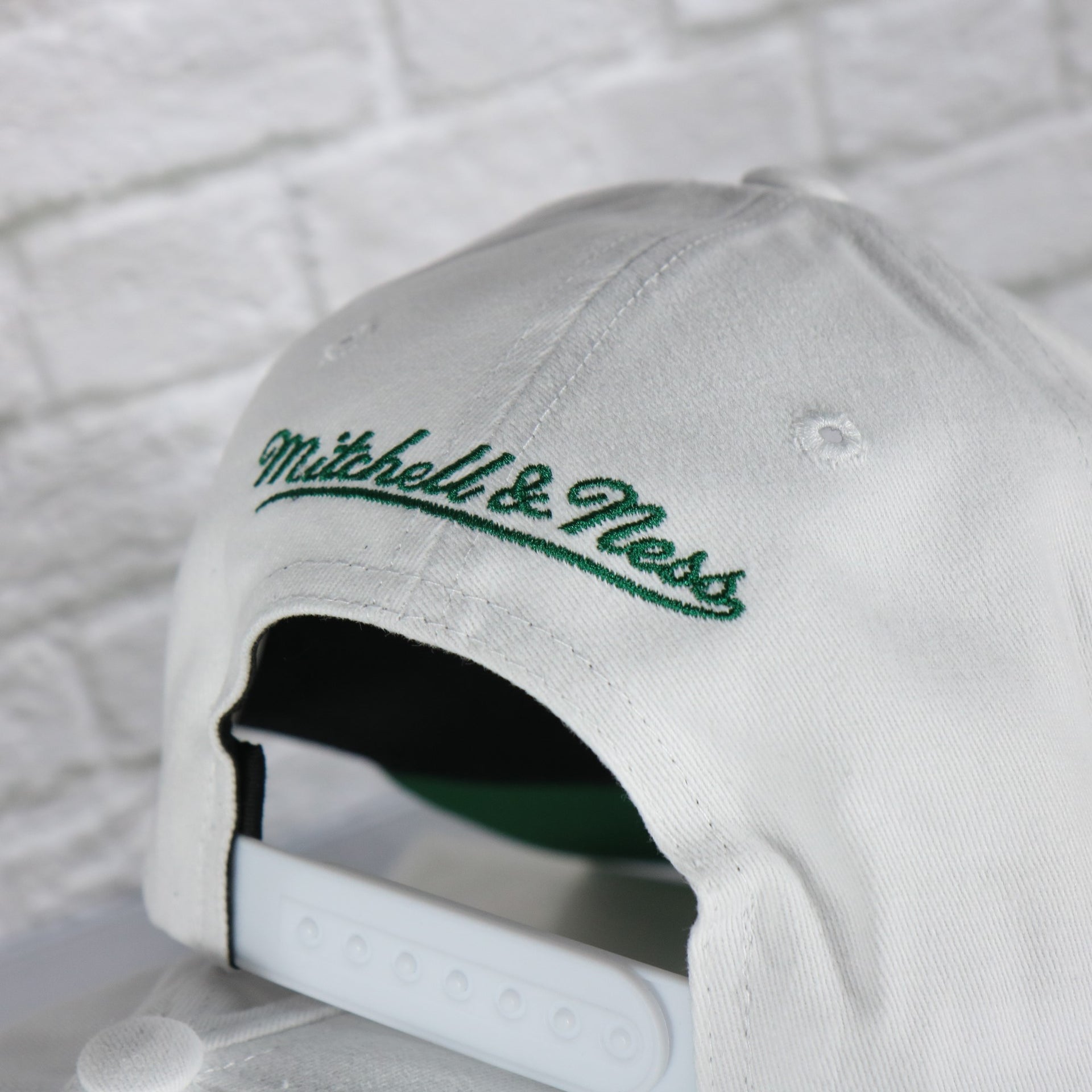 mitchell and ness logo on the Boston Celtics NBA Hardwood Classics All in Pro Green Bottom | White Snapback Hat
